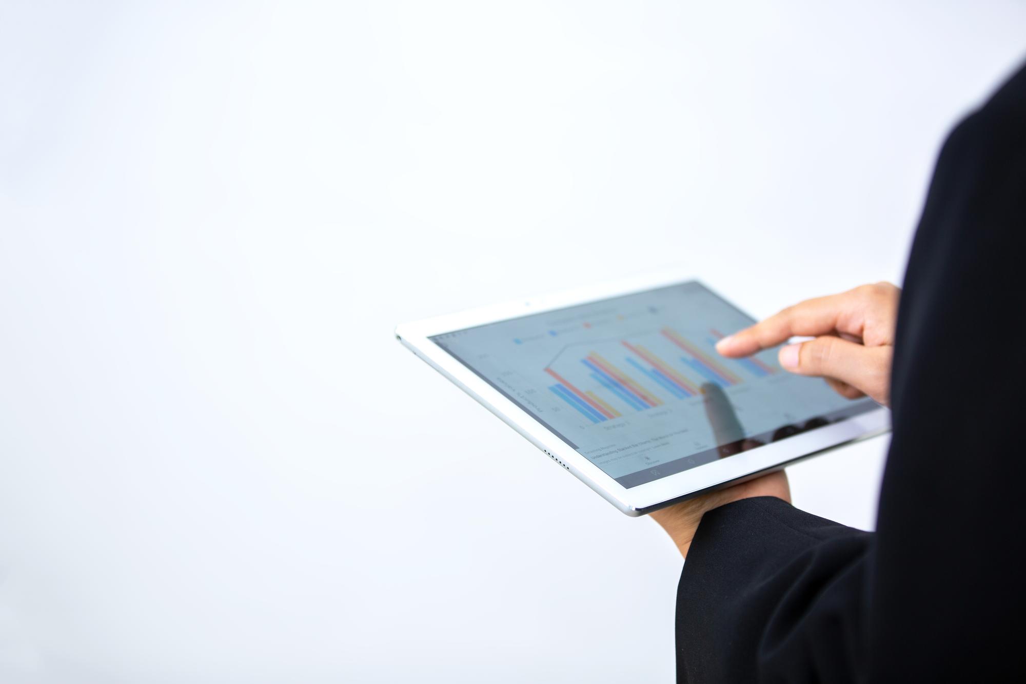Person using finance app on tablet